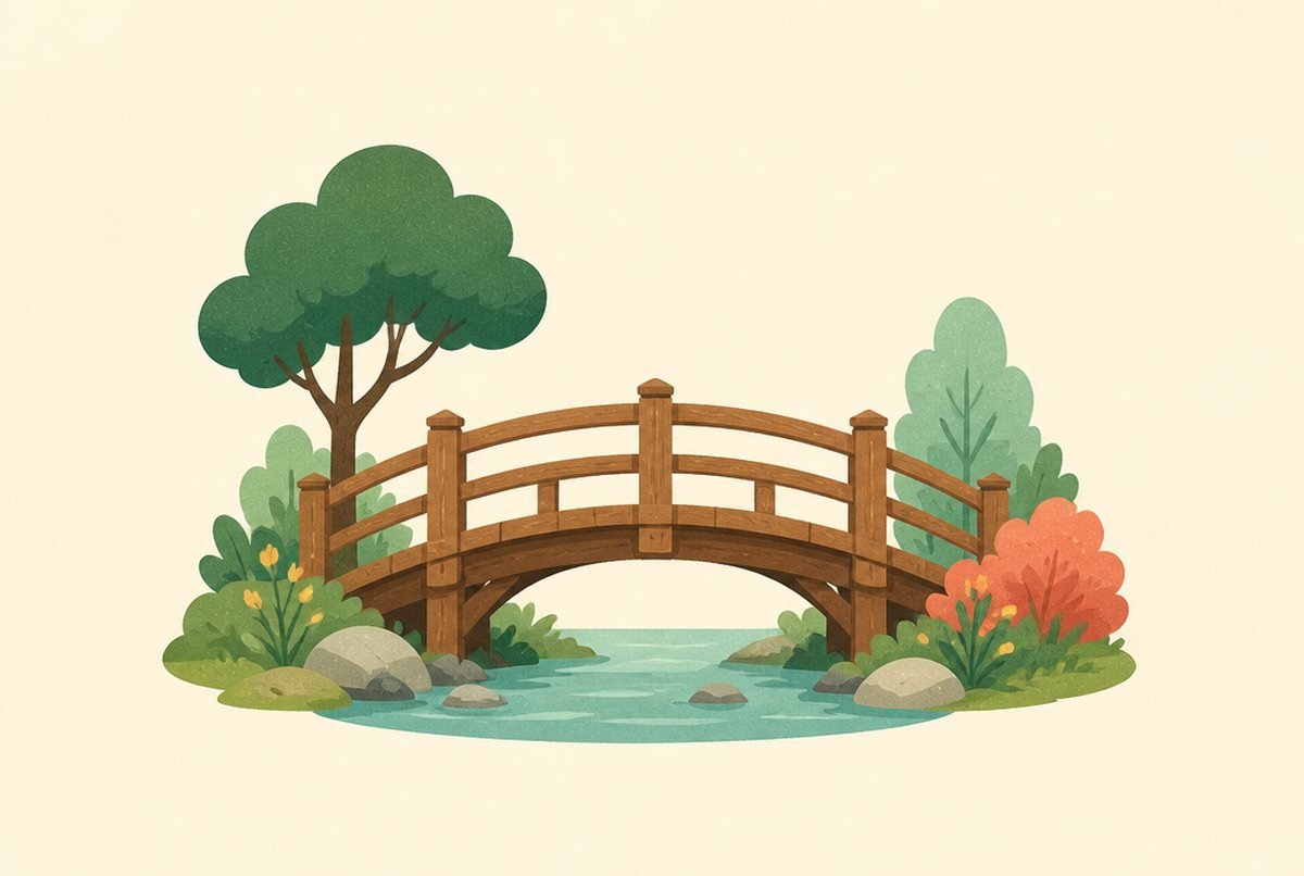 Wooden arched bridge over a small stream, surrounded by green trees and colorful bushes in a park setting.